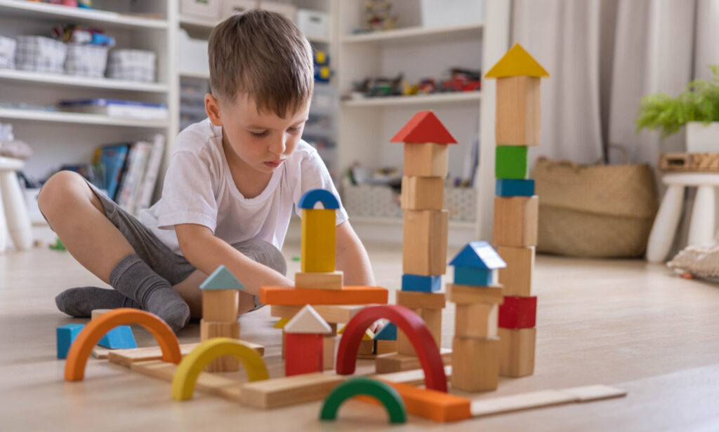 boy play with montessori toys