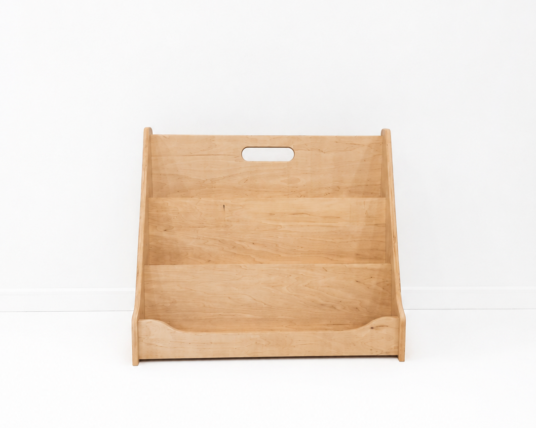 Wooden bookshelf with a handle on a white background