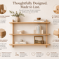 Wall-mounted wooden storage shelf with three open tiers for books and decor